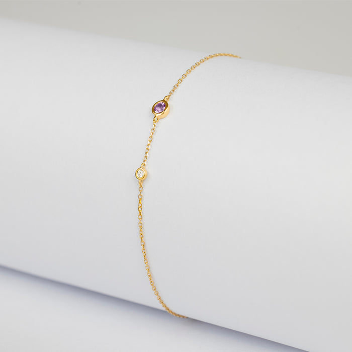 Pulsera Birthstone Premium con Amatista y Diamante en oro amarillo 14 Kt (Febrero)