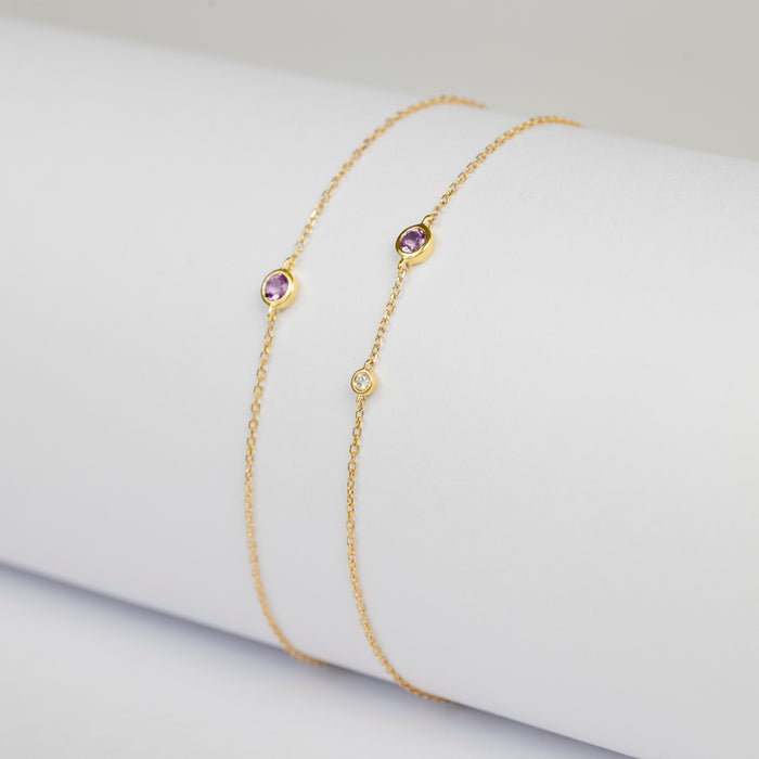 Pulsera Birthstone Premium con Amatista y Diamante en oro amarillo 14 Kt (Febrero)